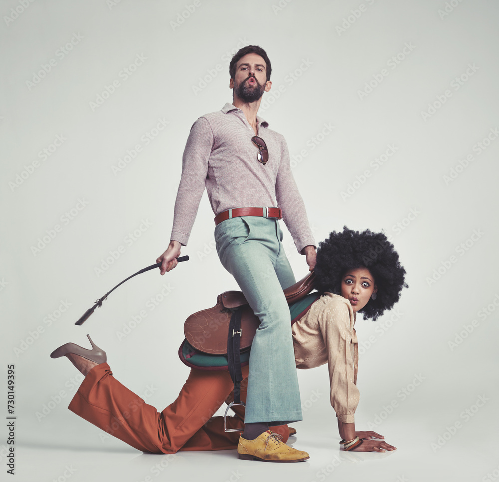 Pyggyback Style Vintage, man and woman or riding crop in studio with piggyback ...
