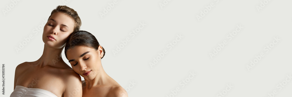 Tenderness. Beautiful girl with nude makeup, clear, spotless skin standing with bare shoulders. Concept of natural beauty, cosmetology and cosmetics, skincare. Banner. Empty space to insert text, ad Tenderness. Beautiful girl with nude makeup, clear, spotless skin standing with bare shoulders. Concept of natural beauty, cosmetology and cosmetics, skincare. Banner. Empty space to insert text, ad