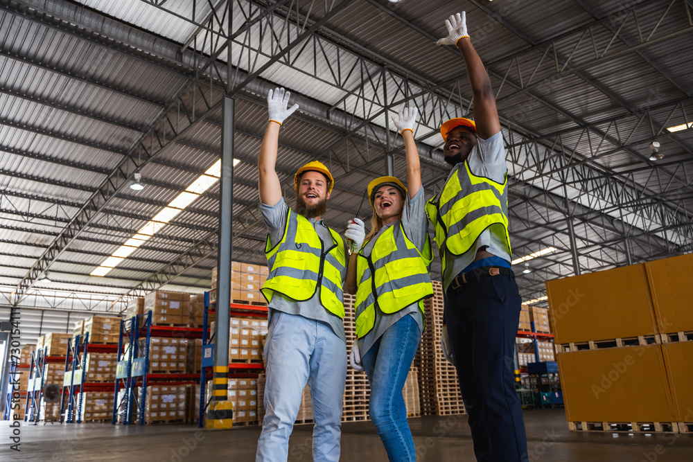 Cheerful diversity factory workers in contribution warehouse Cheerful diversity factory workers in contribution warehouse