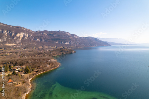 Kayak trip on the Lac du Bourget in Aix-Les-Bains, with aerial view by dorne of the canal from Savières to Chatillon, between castle, mountains and river in Savoie © Sylvain