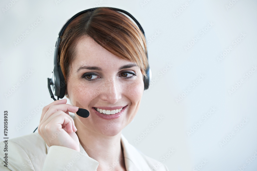 Woman, callcenter and phone call with headset and mic, CRM or contact us with smile for communication. Telecom, customer service or telemarketing with agent for tech support or help desk at office Woman, callcenter and phone call with headset and mic, CRM or contact us with smile for communication. Telecom, customer service or telemarketing with agent for tech support or help desk at office