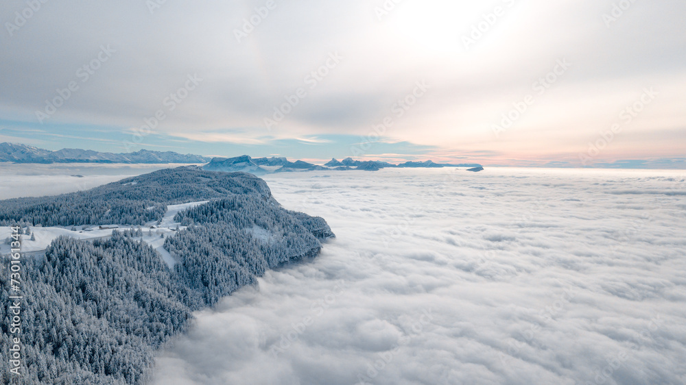 Fototapeta premium drone flight over the snow-capped mountains of Revard in Aix-Les-Bains in Savoie