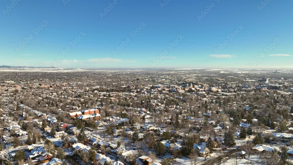 Town of Boulder, Colorado Aerial Drone video after a snow storm on a clear morning with University of Colorado Boulder in the background Town of Boulder, Colorado Aerial Drone video after a snow storm on a clear morning with University of Colorado Boulder in the background