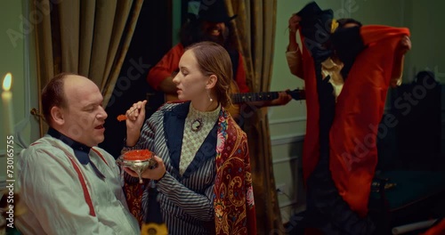 rich aristocratic people eating red caviar in restaurant with gypsies, 19 century, 4K, Prores photo