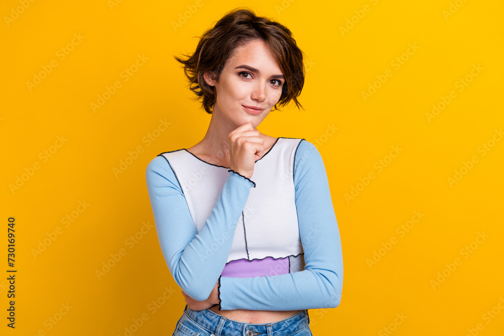 Fototapeta premium Photo of smart clever woman wear top smiling thinking arm chin isolated yellow color background