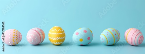 colorful color easter eggs on pastel blue studio background, banner with copyspace, front view