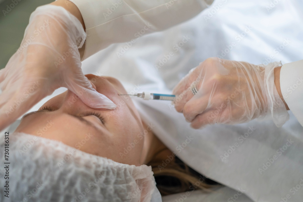 Injection technique on nasolabial lines by a skincare specialist. This is a modern approach to maintaining a youthful appearance. Injection technique on nasolabial lines by a skincare specialist. This is a modern approach to maintaining a youthful appearance.