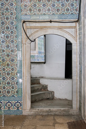 Marble doorway surrounded by decorative tile leading to staircase at Topkapi Palace, Istanbul, Turkey 
