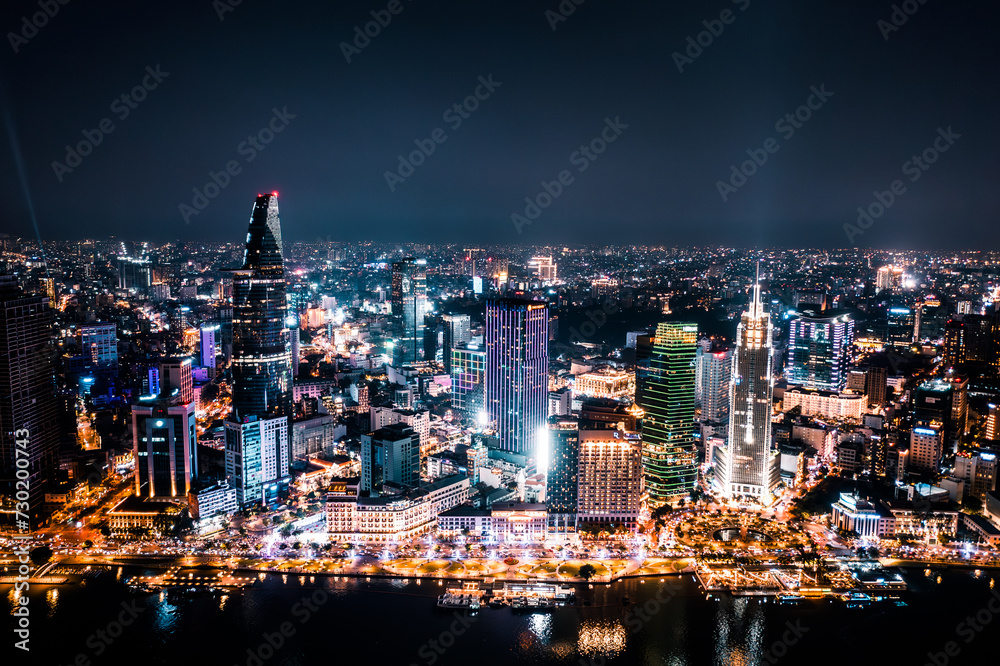 Aerial drone photo - Skyline of Saigon (Ho Chi Minh City) at night. Vietnam