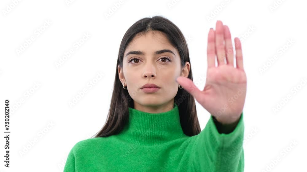 Serious Caucasian woman showing stop sign with palm and shaking head on white background. Restriction, refusal, rejection concept. Serious Caucasian woman showing stop sign with palm and shaking head on white background. Restriction, refusal, rejection concept.