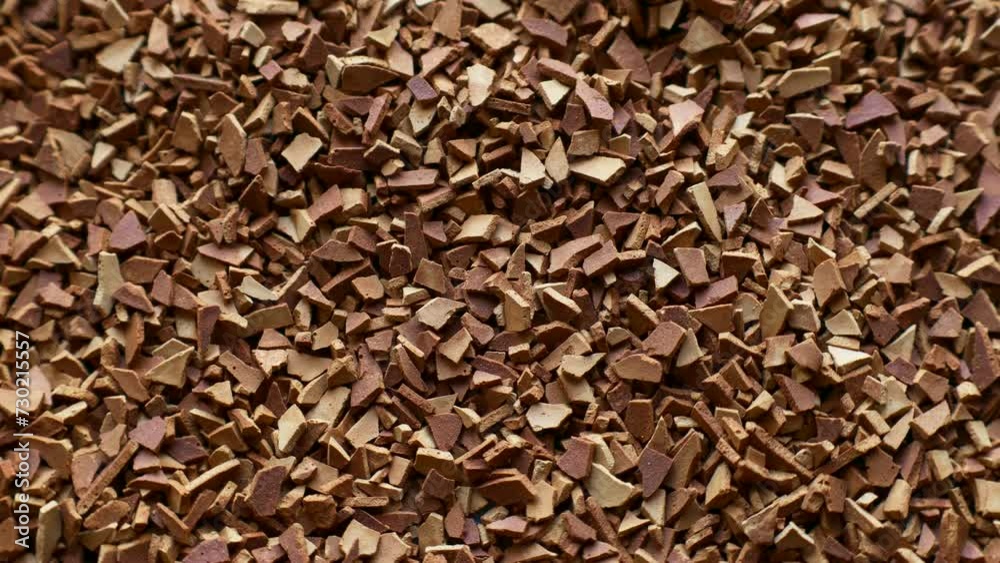 Dried instant coffee granules circle rotation close up top view Dried instant coffee granules circle rotation close up top view