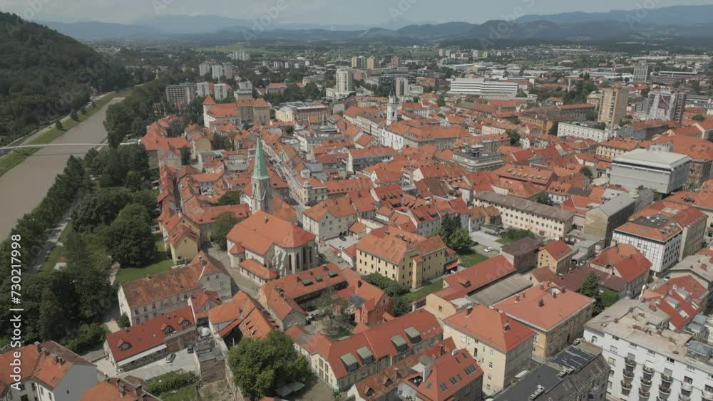 An aerial view of the beautiful city of Celje, Slovenia, reveals the ancient city nestled amidst a picturesque landscape. An aerial view of the beautiful city of Celje, Slovenia, reveals the ancient city nestled amidst a picturesque landscape.