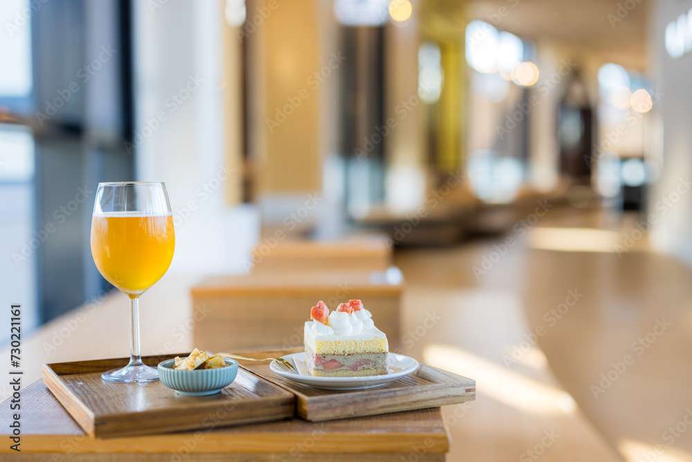 Slice of cake with glass of tea in coffee shop Slice of cake with glass of tea in coffee shop