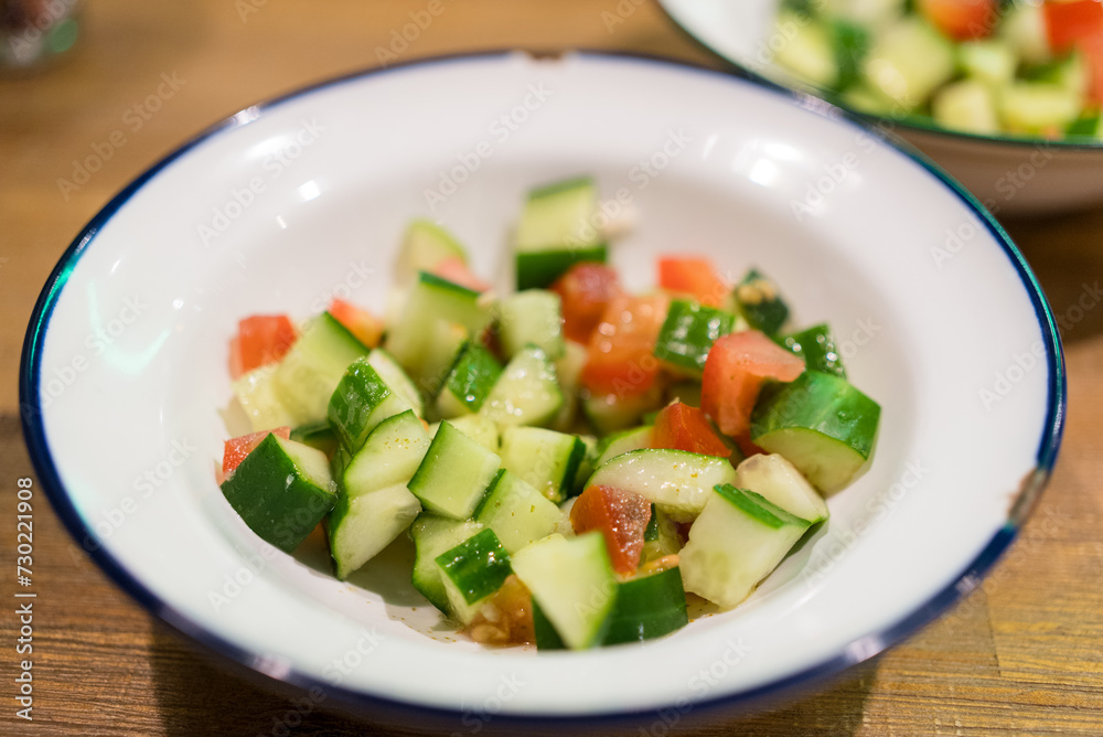 Fresh cucumber salad in the dish