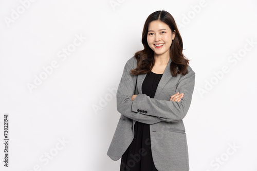 Happy young Asian startup businesswoman smiling in white studio isolated background