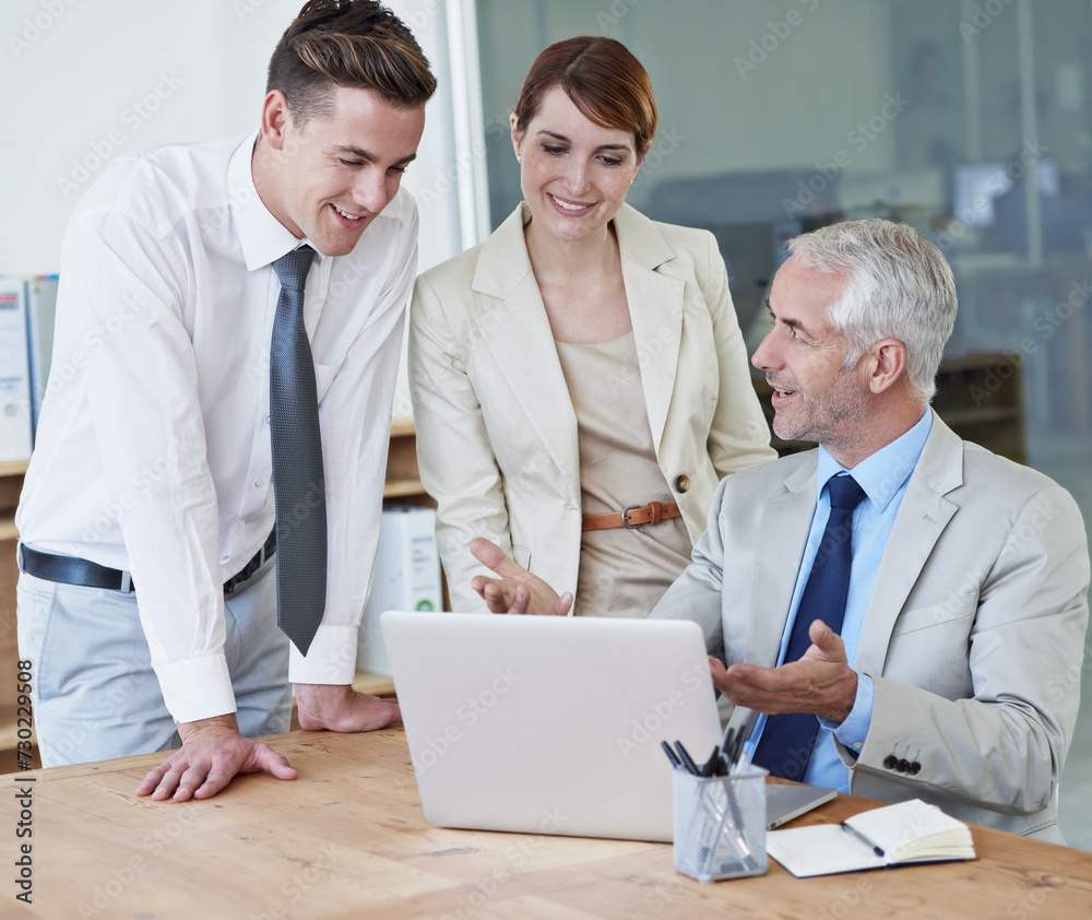 Fototapeta premium Business people, laptop and discussion for planning in boardroom, communication and meeting in office. Senior manager, employees and technology for assistance in training, mentor and advice for work
