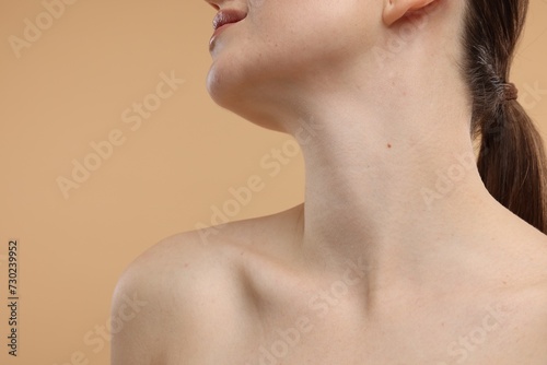 Beauty concept. Woman on beige background, closeup