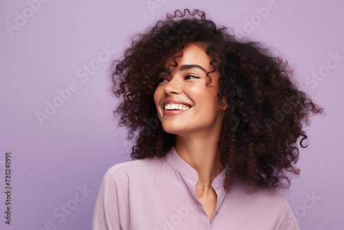 Portrait of smiling african american woman with curly hair.