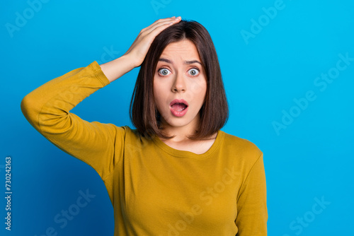 Photo of excited impressed woman wear shirt arm head open mouth empty space isolated blue color background © deagreez