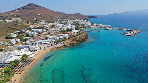 Aerial drone video of small coastal village and beach of Piso livadi in island of Paros, Cyclades, Greece