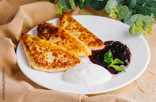 Pancakes with sour cream and jam