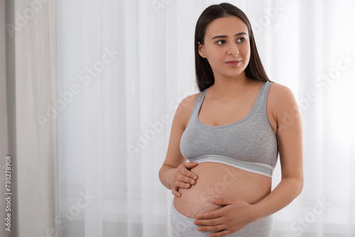 Beautiful pregnant woman in comfortable maternity underwear indoors, space for text Free Download Beautiful pregnant woman in comfortable maternity underwear indoors, space for text - GFXLoad
