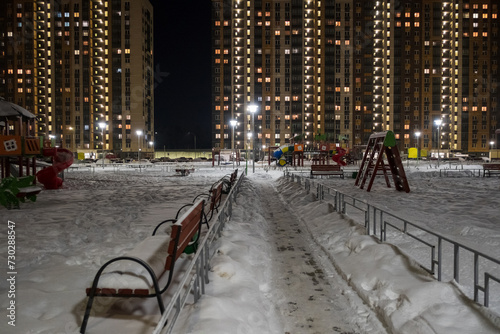 courtyard among high-rise buildings on a winter night