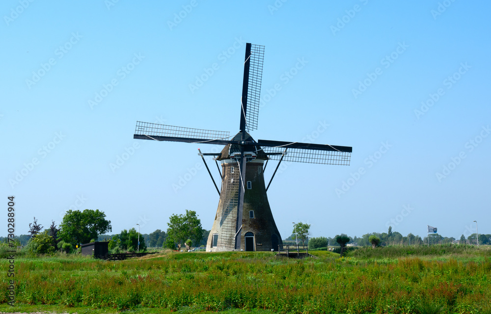 Traditional Dutch windmill on a sunny summer day