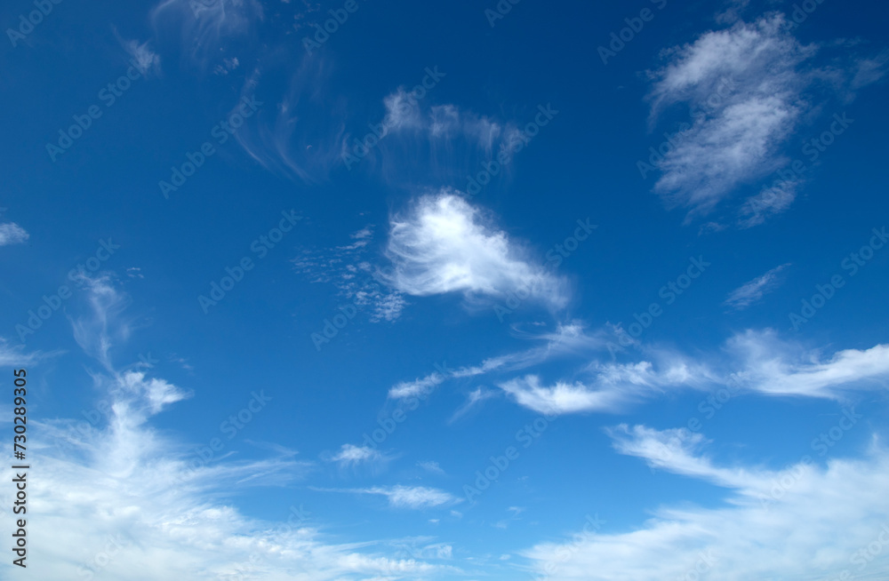 White fluffy clouds in the blue sky. White fluffy clouds in the blue sky.