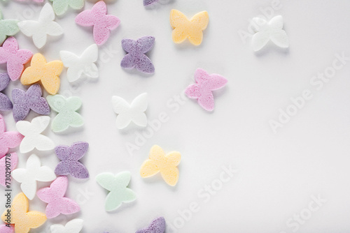 Colorful sugar sprinkles on white background