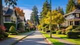 Neighbourhood of luxury houses with street road, big trees and nice landscape in Vancouver, Canada. Blue sky 