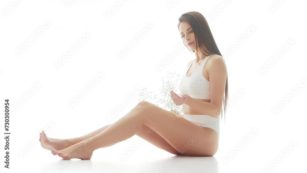 Beautiful woman in white underwear over isolated white background. Studio video of healthy young girl in swimsuit. Health and skin care, wellness, dieting and cosmetics concept. Beautiful woman in white underwear over isolated white background. Studio video of healthy young girl in swimsuit. Health and skin care, wellness, dieting and cosmetics concept.
