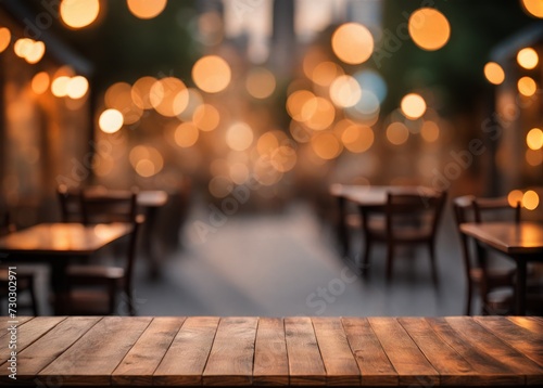 Wooden Table Illuminated by Evening Street Blurred Bokeh: Cozy Urban Ambiance © Louis