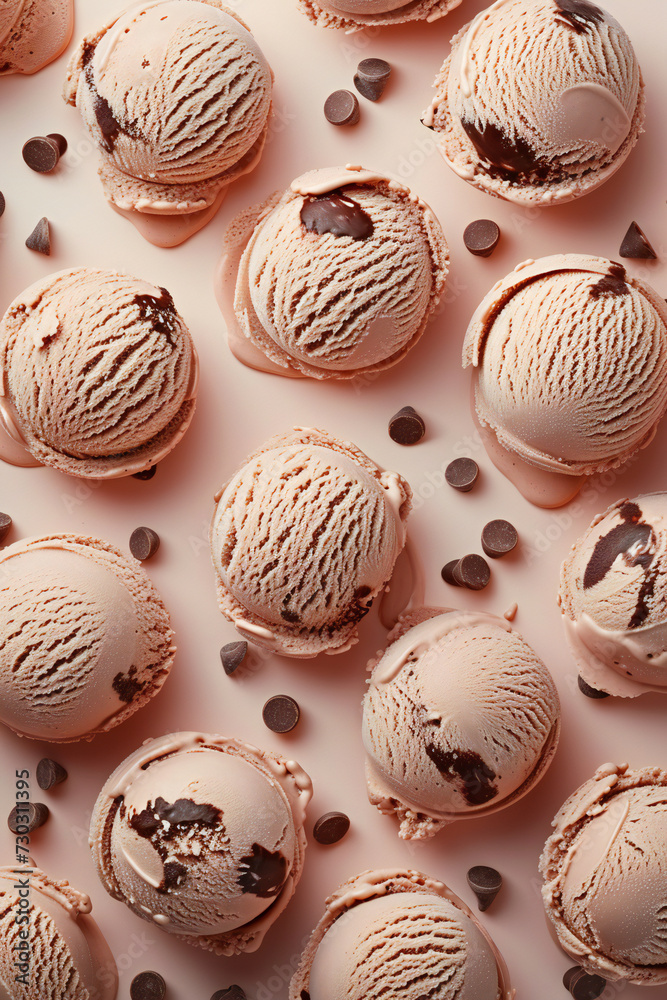 Chocolate scoops of cold and delicious ice cream pattern on a pastel color background. Summer refreshing concept. Chocolate scoops of cold and delicious ice cream pattern on a pastel color background. Summer refreshing concept.