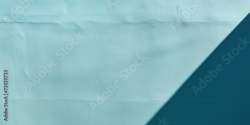 Cyan wall with shadows on it  top view  flat lay background texture