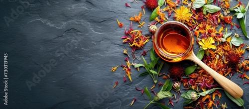 Spoon with safflower, herbal tea. photo