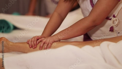 Wallpaper Mural Hands of woman massaging girl leg using massage oil in spa Torontodigital.ca