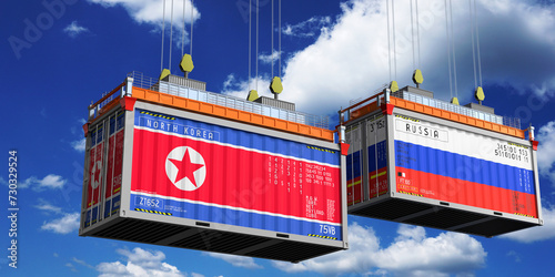 Shipping containers with flags of North Korea and Russia - 3D illustration photo