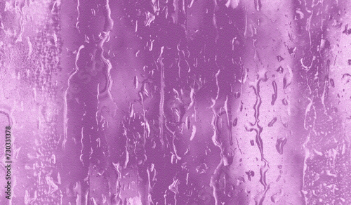 pink background. of natural water condensation on window glass  photo