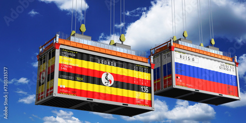 Fototapeta Naklejka Na Ścianę i Meble -  Shipping containers with flags of Uganda and Russia - 3D illustration