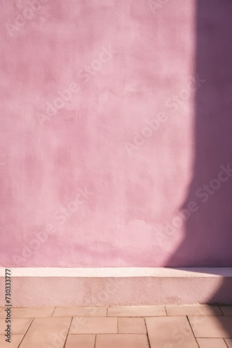 Mauve wall with shadows on it