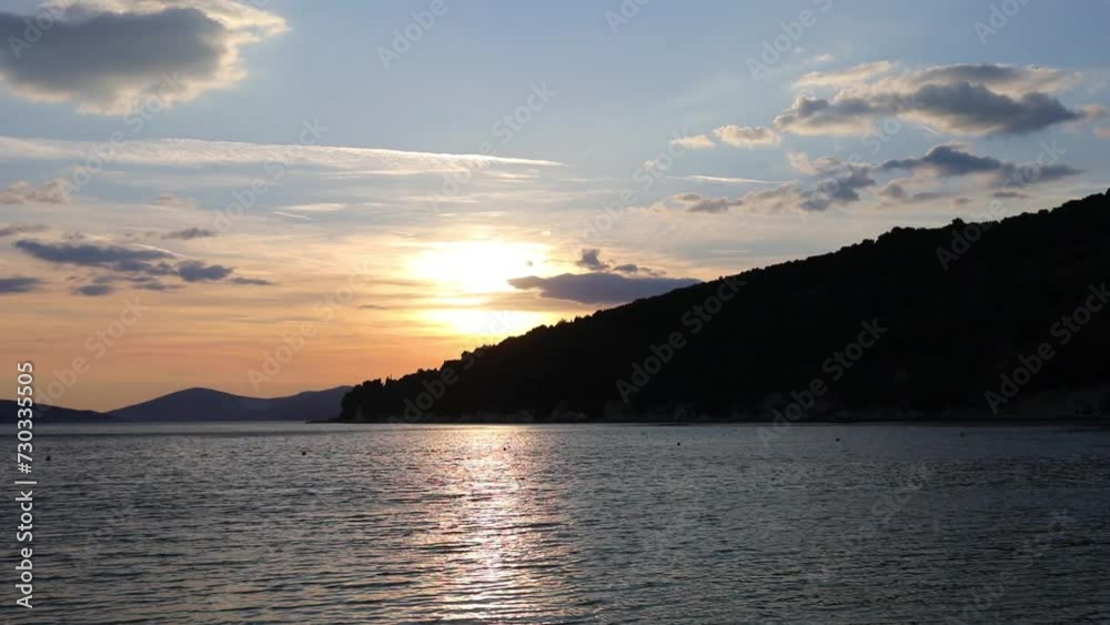 Beautiful sunset at seashore with mountains at spring evening Beautiful sunset at seashore with mountains at spring evening