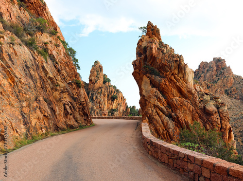 route D81 snaked along the Corsican coast a ribbon of asphalt clinging to the rugged cliffs