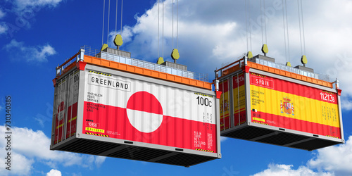 Shipping containers with flags of Greenland and Spain - 3D illustration