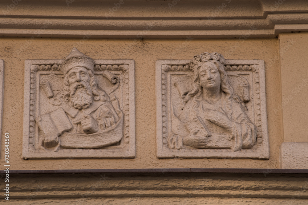 Munich, Germany -April 27,2023: Details of stone ornaments on the facades of baroque buildings in the German city Munich. Munich, Germany -April 27,2023: Details of stone ornaments on the facades of baroque buildings in the German city Munich.