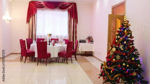  Christmas tree and served table in cafe in Bogorodskoye manor, This manor is place for celebrations and festivities  photo