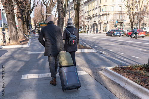 Tourist couple with suitcases in Bergamo, Lombardy