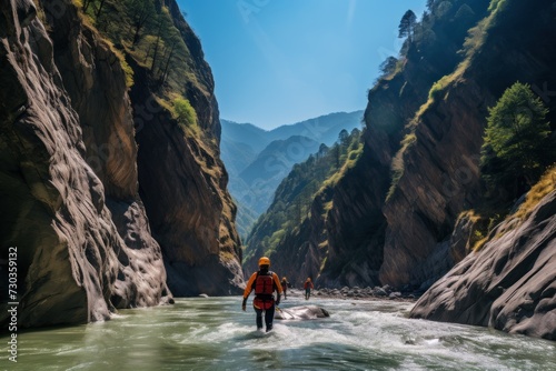 Canyoning extreme sport. canyoning expedition, popular trails, hard impressive spot. Travelling group exploring a wild untamed river canyon with energy, freedom and adrenaline
