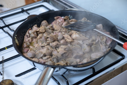 Cooking chicken gizzard livers and hearts using pan