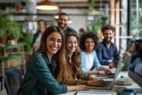 Successful business team smiling and sitting together in a startup office